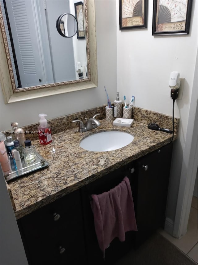 bathroom featuring tile patterned floors and vanity