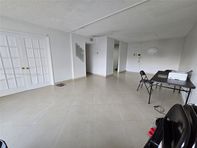 interior space featuring a textured ceiling