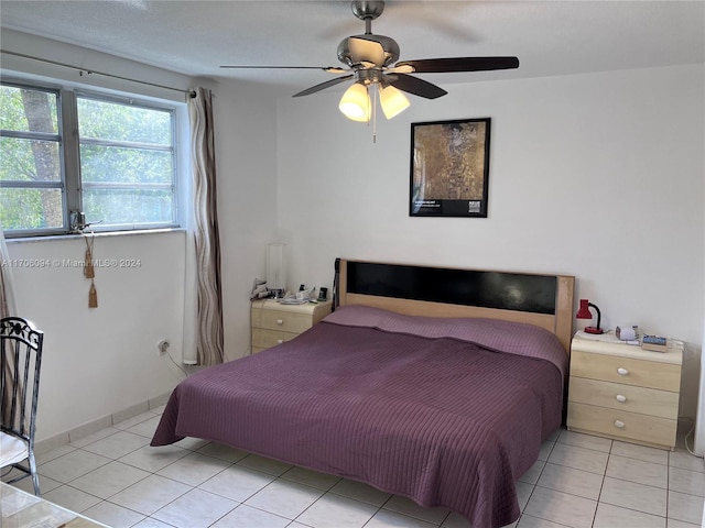 bedroom featuring ceiling fan and light tile patterned flooring