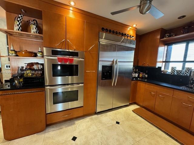 kitchen featuring ceiling fan and appliances with stainless steel finishes