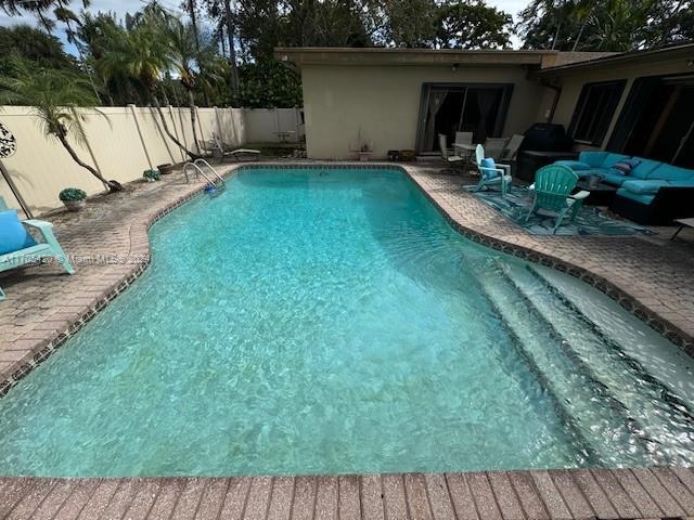 view of pool with a patio