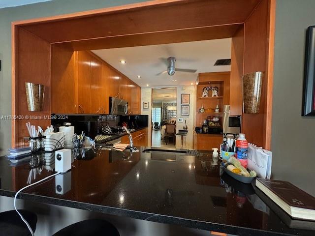 kitchen featuring ceiling fan