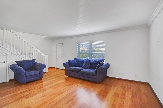 living room featuring wood-type flooring and crown molding