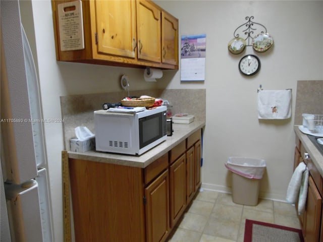 kitchen with light tile patterned floors