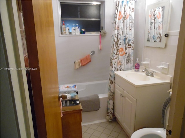 bathroom featuring vanity, tile patterned flooring, and shower / bathtub combination with curtain