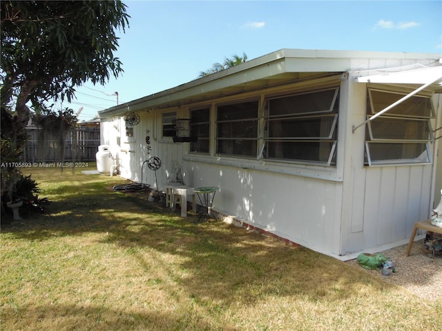 view of property exterior featuring a yard