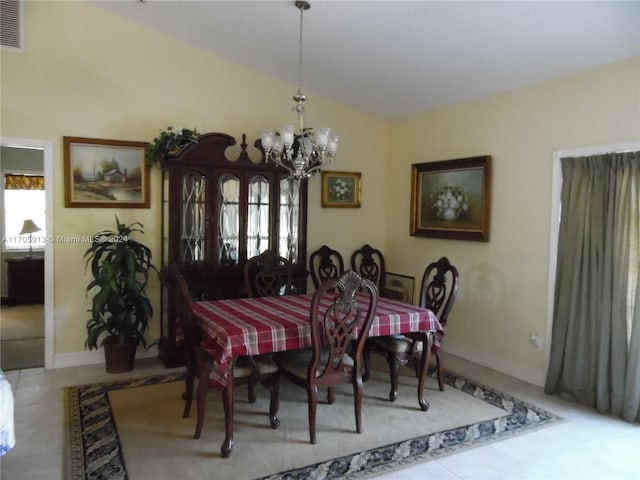 dining space featuring a notable chandelier