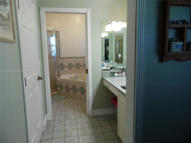 bathroom featuring tile patterned floors, vanity, and independent shower and bath