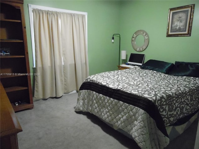 bedroom featuring light carpet