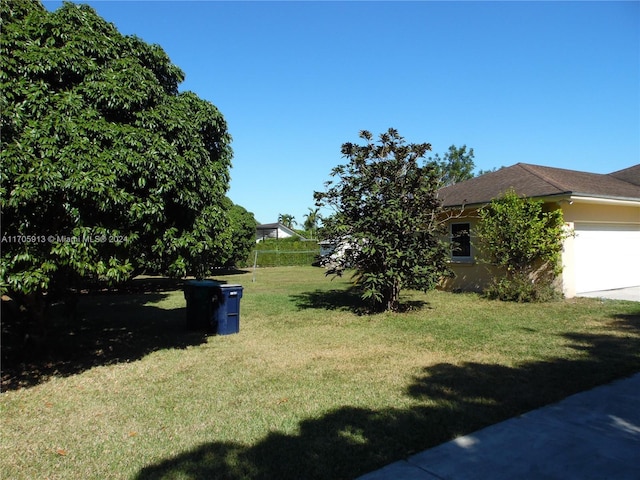 view of yard with a garage