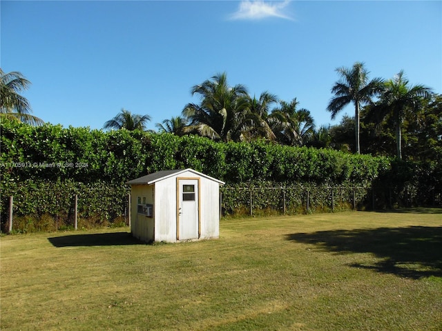 view of outdoor structure with a lawn