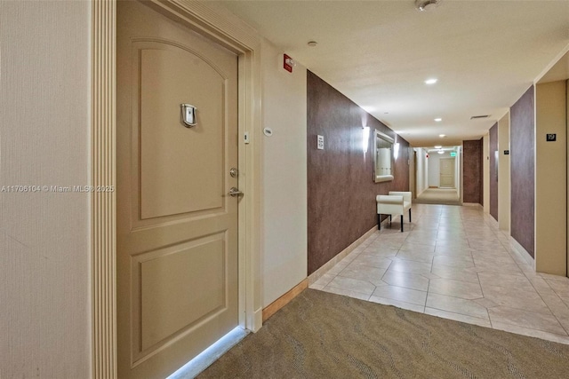 corridor featuring light tile patterned floors