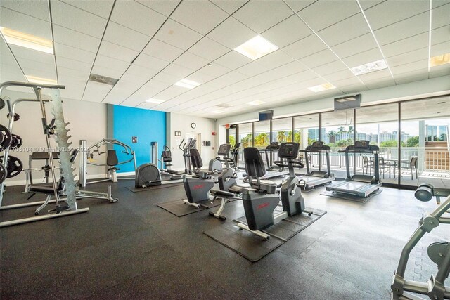 exercise room featuring a paneled ceiling