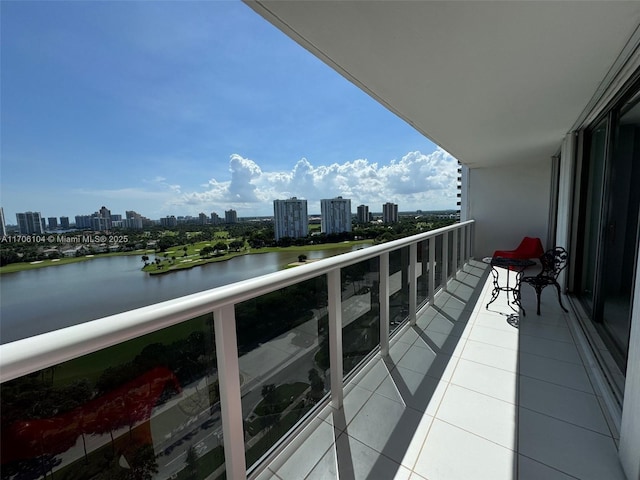 balcony featuring a water view