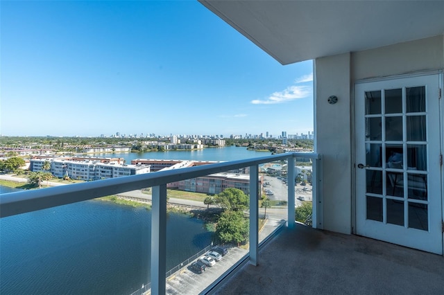 balcony featuring a water view