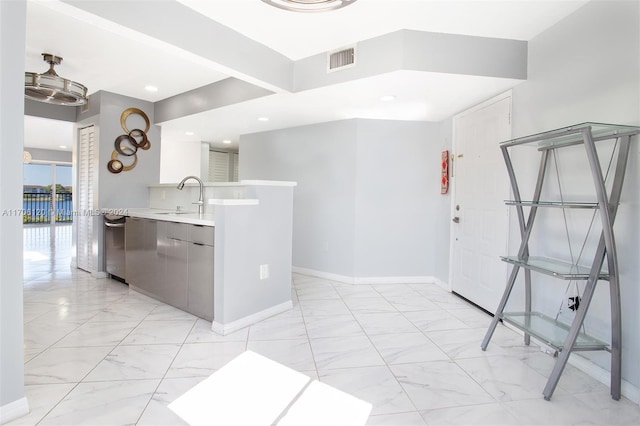 1400 SW 131st Way Unit 401Q, Pembroke Pines, FL 33027 - kitchen featuring light marble finish floors, light countertops, recessed lighting, stainless steel dishwasher, and modern cabinets