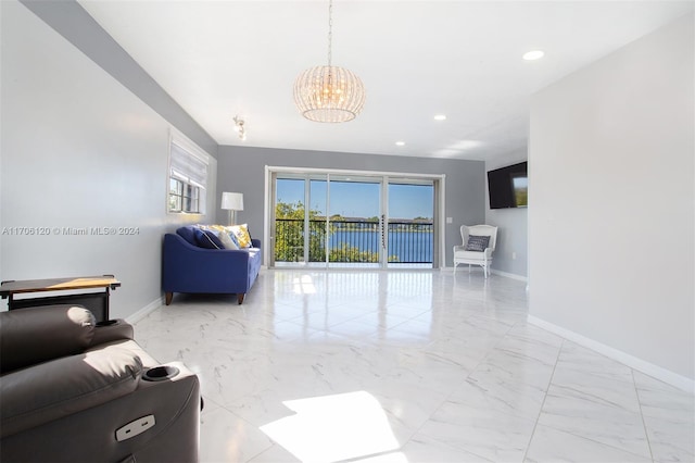 living room with an inviting chandelier