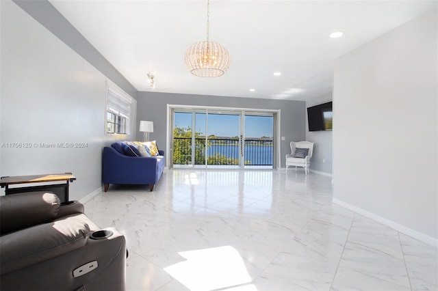 1400 SW 131st Way Unit 401Q, Pembroke Pines, FL 33027 - living room with a chandelier, light marble finish flooring, and recessed lighting