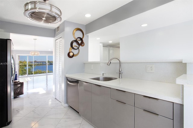 1400 SW 131st Way Unit 401Q, Pembroke Pines, FL 33027 - kitchen with stainless steel appliances, light marble finish flooring, gray cabinets, light countertops, and recessed lighting