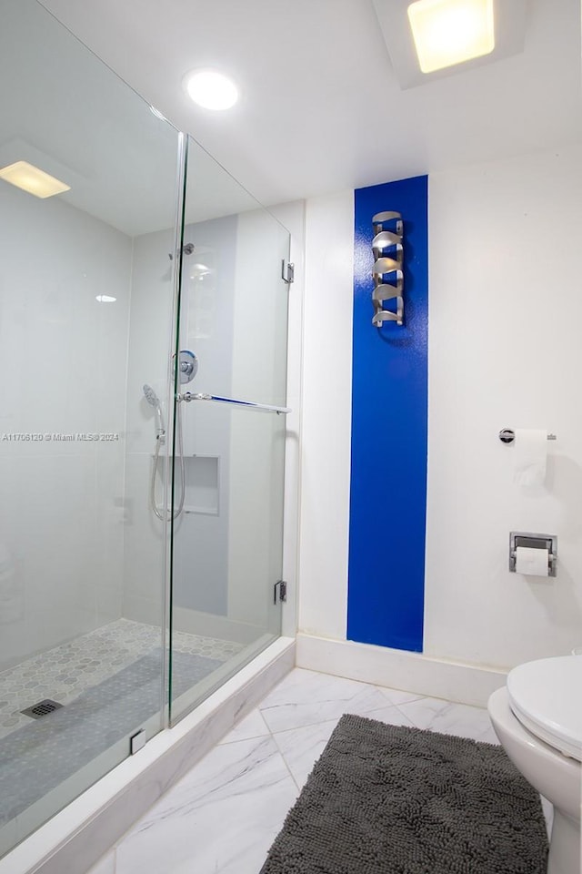 bathroom with toilet and walk in shower