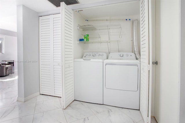 laundry area featuring separate washer and dryer