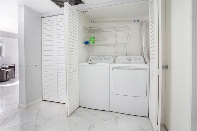 1400 SW 131st Way Unit 401Q, Pembroke Pines, FL 33027 - laundry area with light marble finish floors and separate washer and dryer