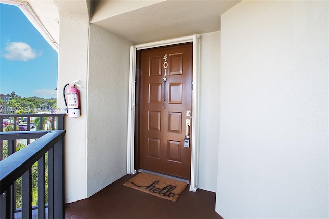 doorway to property featuring a balcony