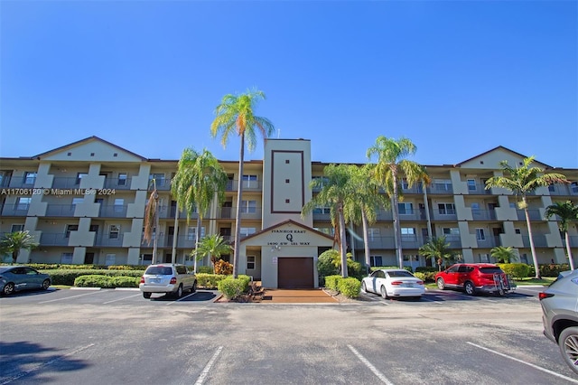 1400 SW 131st Way Unit 401Q, Pembroke Pines, FL 33027 - view of apartment building / complex featuring uncovered parking