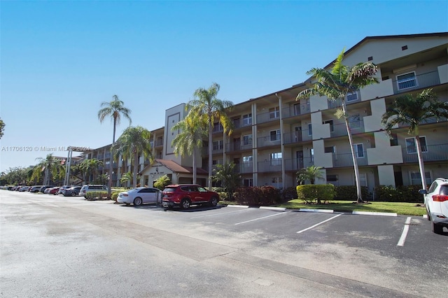 1400 SW 131st Way Unit 401Q, Pembroke Pines, FL 33027 - view of apartment building / complex featuring uncovered parking