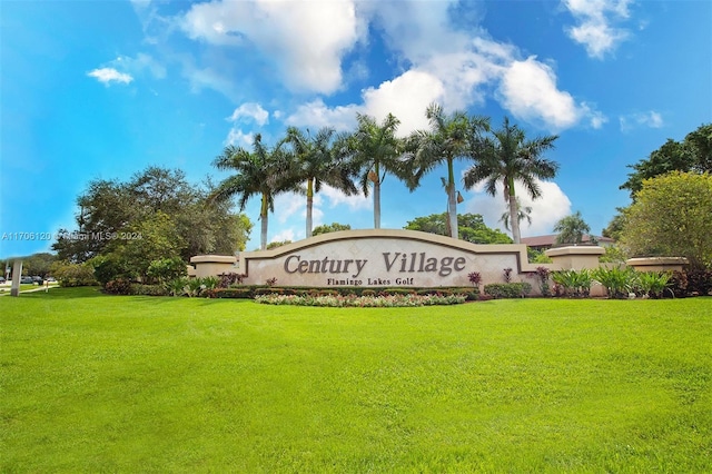 community / neighborhood sign featuring a yard