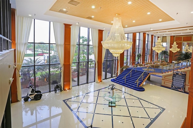 1400 SW 131st Way Unit 401Q, Pembroke Pines, FL 33027 - lobby with floor to ceiling windows, recessed lighting, and a towering ceiling