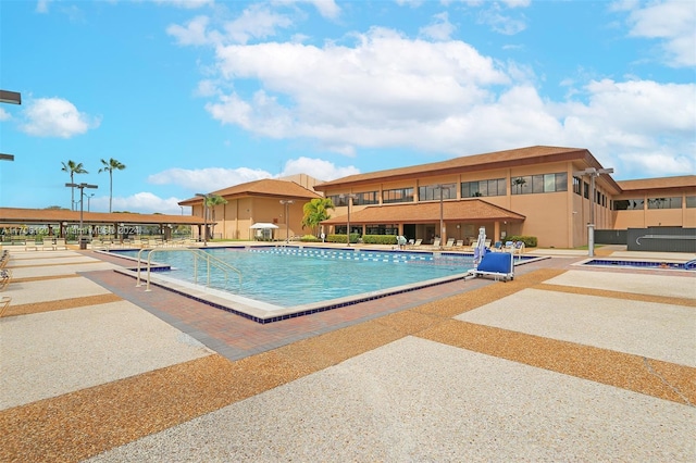 view of pool featuring a patio area