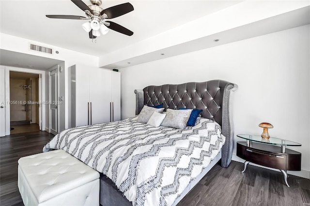 bedroom with ceiling fan and dark hardwood / wood-style flooring