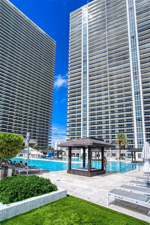 view of pool featuring a gazebo and a patio