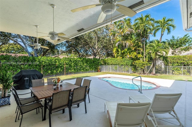 view of pool featuring a patio area and a grill