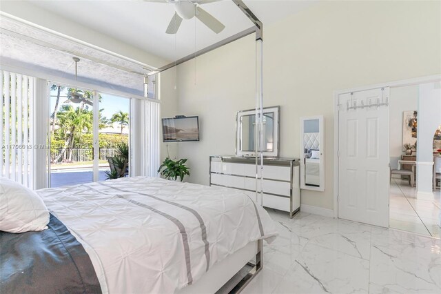 bedroom featuring ceiling fan and access to outside