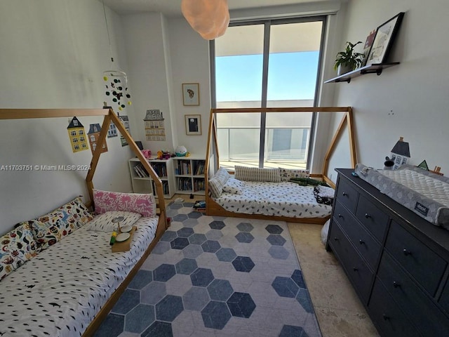 bedroom featuring multiple windows