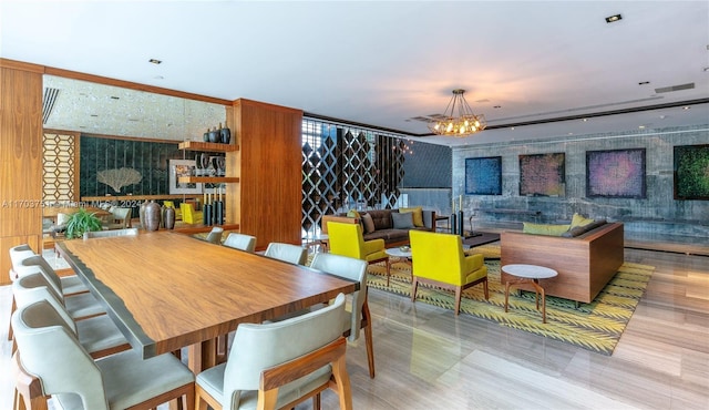 dining area featuring a notable chandelier