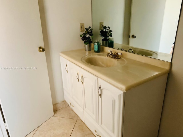 bathroom with tile patterned flooring and vanity