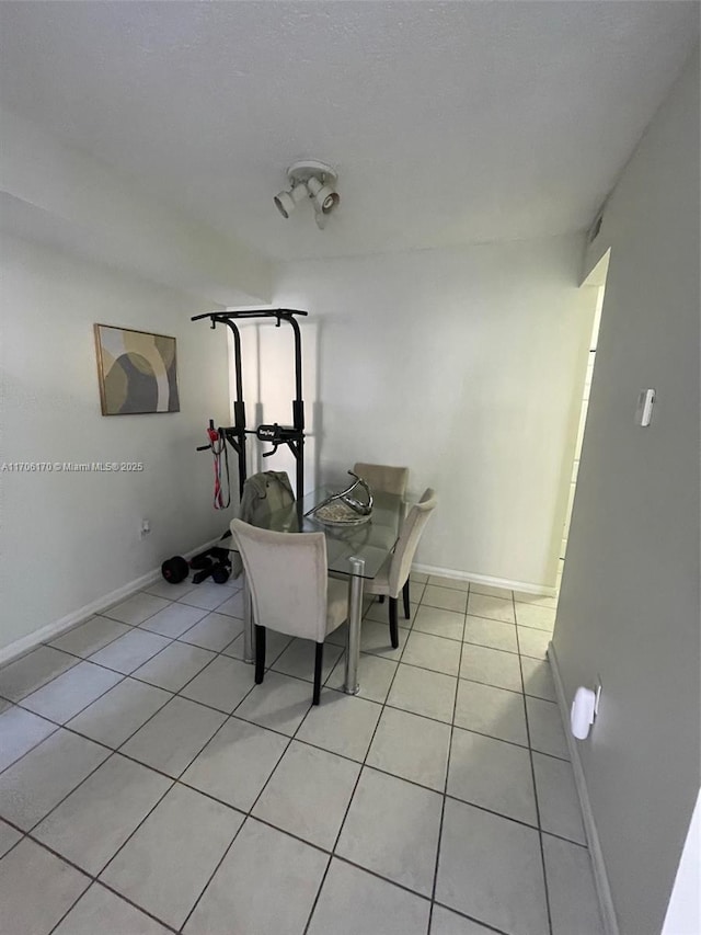 dining area with light tile patterned flooring