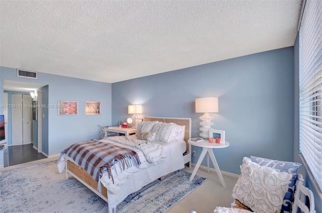 bedroom featuring a textured ceiling