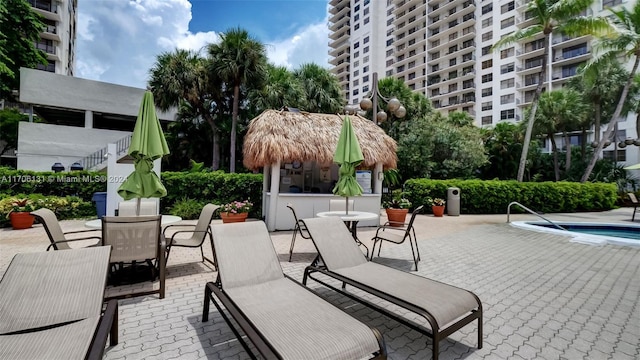 view of patio / terrace featuring a pool