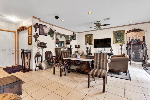 tiled living room with ceiling fan and crown molding