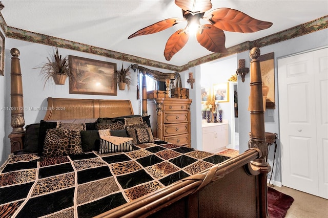 bedroom featuring carpet, ensuite bath, a closet, and ceiling fan