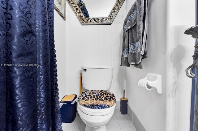 bathroom with tile patterned floors and toilet