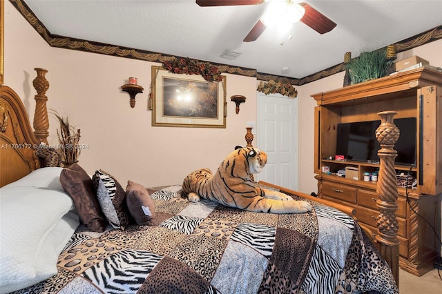 carpeted bedroom featuring a textured ceiling and ceiling fan