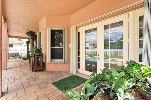 entrance to property with a patio and french doors