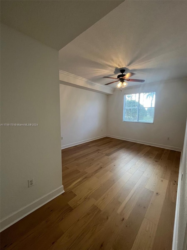 unfurnished room featuring wood-type flooring and ceiling fan