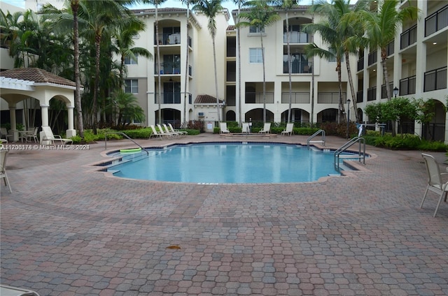 view of swimming pool with a patio area