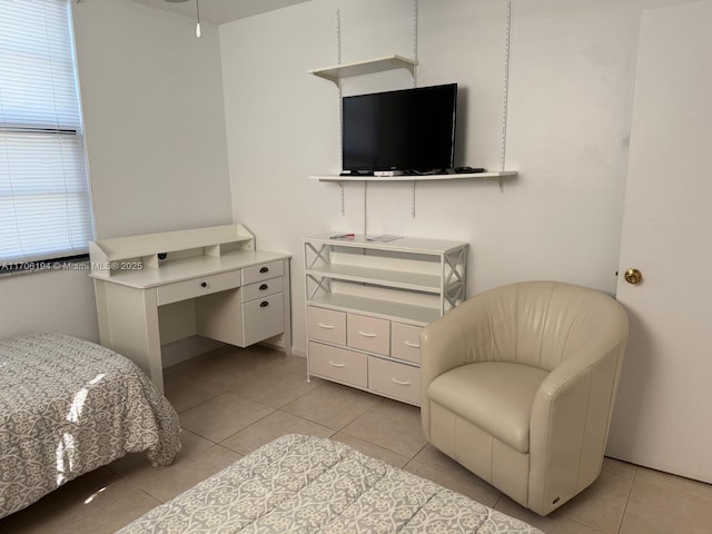 bedroom with light tile patterned floors